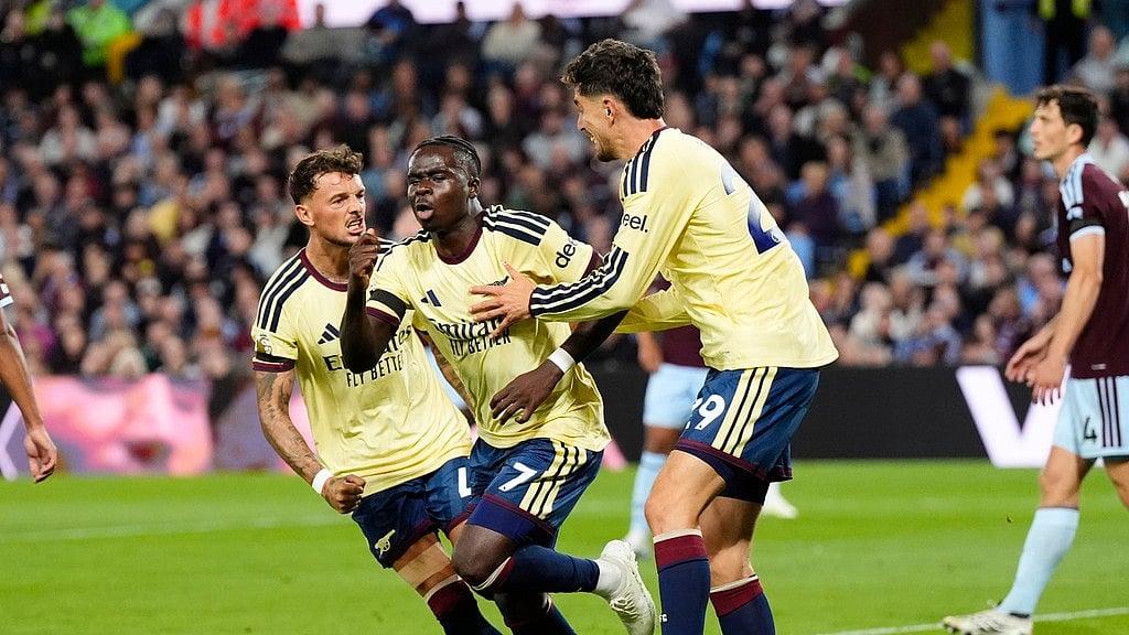 Arsenal's Bukayo Saka (7) celebrates after scoring his side's opening goal during the English Premier League soccer match between Aston Villa and Arsenal in Birmingham, England, Monday, Aug. 31, 2026. (Nick Potts/PA via AP)