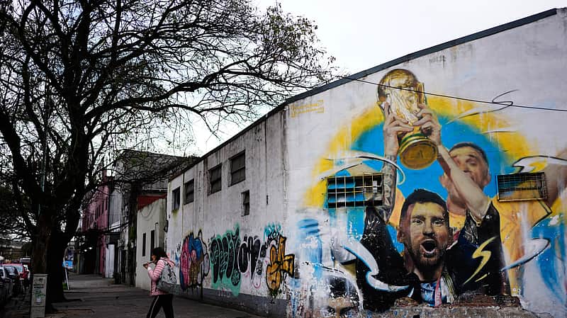 A mural of Argentine soccer player Lionel Messi holding the World Cup trophy covers a building in Buenos Aires, Argentina, Monday, Aug. 31, 2026. (AP Photo/Natacha Pisarenko)
