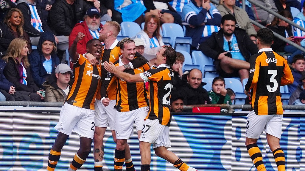 Hull City's Liam Millar, third left, celebrates scoring with teammates during the English Premier League soccer match between Coventry City and Hull City in Coventry, England, Saturday Aug. 29, 2026. (David Davies/PA via AP)