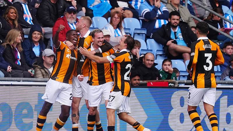 Hull City's Liam Millar, third left, celebrates scoring with teammates during the English Premier League soccer match between Coventry City and Hull City in Coventry, England, Saturday Aug. 29, 2026. (David Davies/PA via AP)