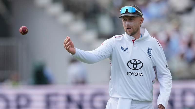 England's captain Joe Root passes the ball to a teammate on day four of the second cricket test match between England and Pakistan in London, Sunday, Aug. 30, 2026. (AP Photo/Dave Shopland)