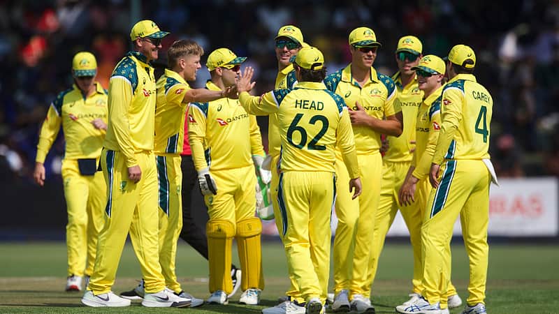 Australian players rejoicing after taking a wicket.