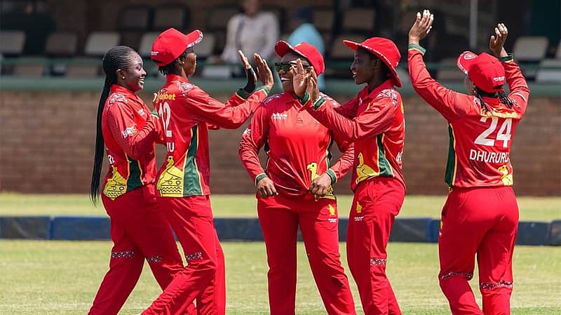 Zimbabwean players rejoicing after taking a wicket.