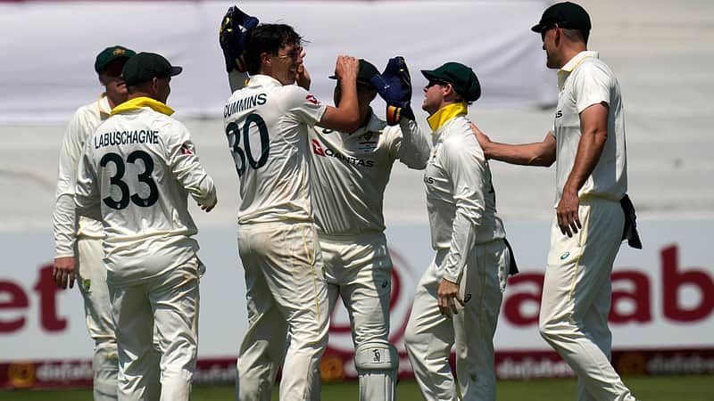 Australian players rejoicing after taking a wicket.