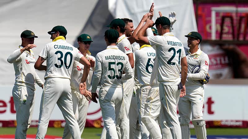 Australian players rejoicing after taking a wicket.