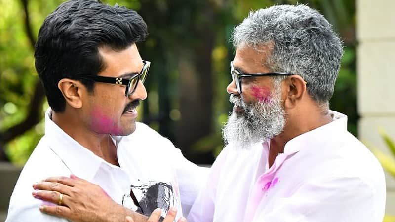 Director Sukumar with actor Ram Charan.