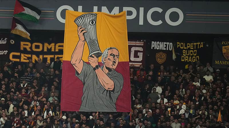 A banner depicting Real Madrid's head coach Jose Mourinho is displayed by Roma fans during a Champions League opening phase soccer match between Roma and Real Madrid, in Rome, Wednesday, Oct.14, 2026. (AP Photo/Alessandra Tarantino)