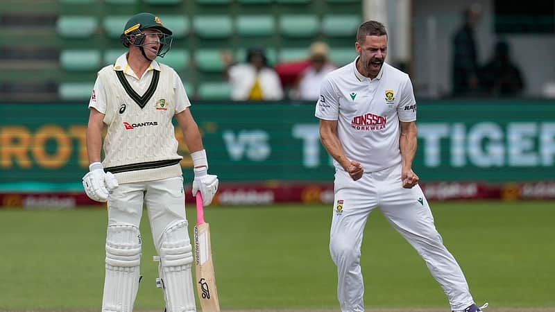 South Africa's Anrich Nortje, right, celebrates the wicket of Australia's Marnus Labuschagne during day four of the second cricket test match between South Africa and Australia, in Gqeberha, South Africa, Wednesday, Oct. 21, 2026. (AP Photo/Themba Hadebe)