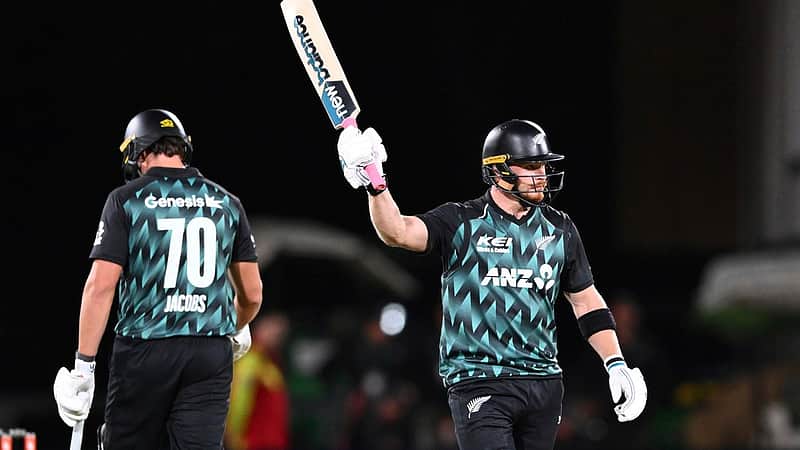 New Zealand's Glenn Phillips gestures with his bat after scoring 50 runs during the T20 cricket international between New Zealand and India in Christchurch, New Zealand, Thursday, Oct. 22, 2026. (Chris Symes/Photosport via AP)