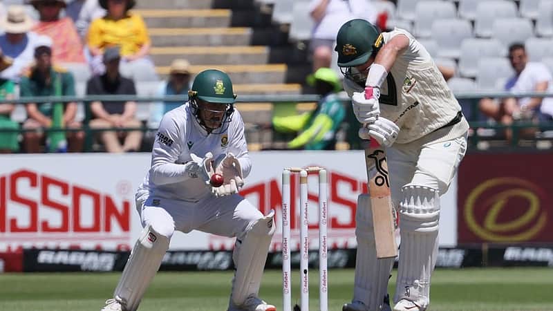 Australia's Marnus Labuschagne, right, plays a shot as South Africa's Ryan Rickelton watches on during day two of the third cricket test match between South Africa and Australia, in Cape Town, South Africa, Wednesday, Oct. 28, 2026. (AP Photo/Halden Krog)