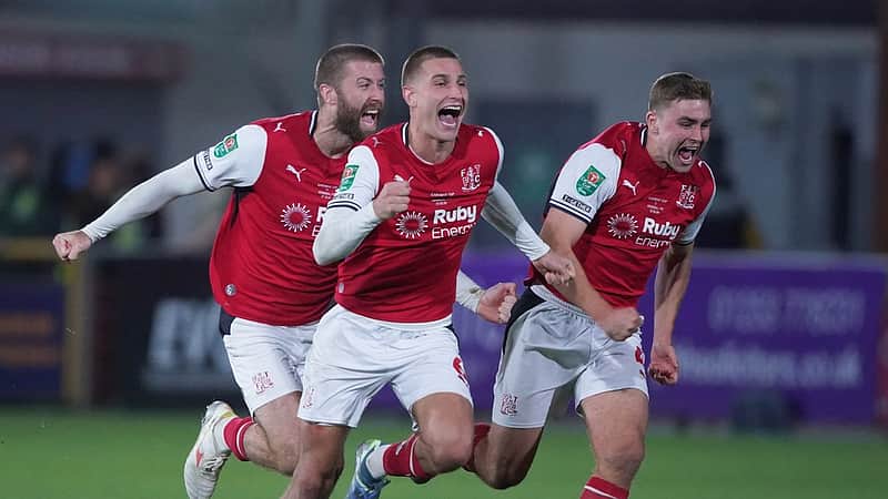 Fleetwood's players celebrate after winning a penalty shootout during the English League Cup soccer match between Fleetwood Town and Arsenal in Fleetwood, England, Tuesday, Oct. 27, 2026. (AP Photo/Ian Hodgson)
