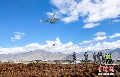 சீனாவின் திபெத்தில் விமானம் மூலம் மரங்களின் விதை தூவுதல்