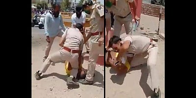 மின்னியபொலிஸ் பாணி: முகக்கவசம் அணியாதவரின் கழுத்தை முட்டியால் அழுத்திய காவலர்