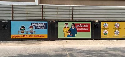 அரசு மருத்துவமனை சுற்றுச் சுவரில் கரோனா விழிப்புணா்வு ஓவியங்கள்