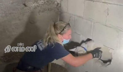 சுவர்களுக்கு இடையே சிக்கிய நாய்; 5 நாள்களுக்குப் பிறகு பத்திரமாக மீட்பு (விடியோ)