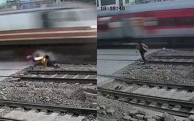 ரயிலில் சிக்கி நூலிழையில் உயிர்த் தப்பிய இளைஞர் (விடியோ)