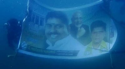 புதுச்சேரி அமைச்சர் நமச்சிவாயம் பிறந்தநாள்: கடலுக்கடியில் வாழ்த்து பேனர்