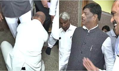 அமைச்சருக்கு காலணி மாட்டிவிடும் பாதுகாவலர்: வைரலாகும் விடியோ