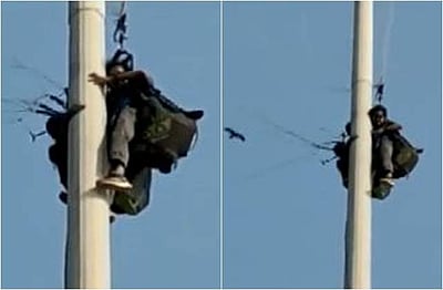 பாராகிளைடிங் விபத்து! கம்பத்தில் சிக்கிய ஆண்-பெண்!